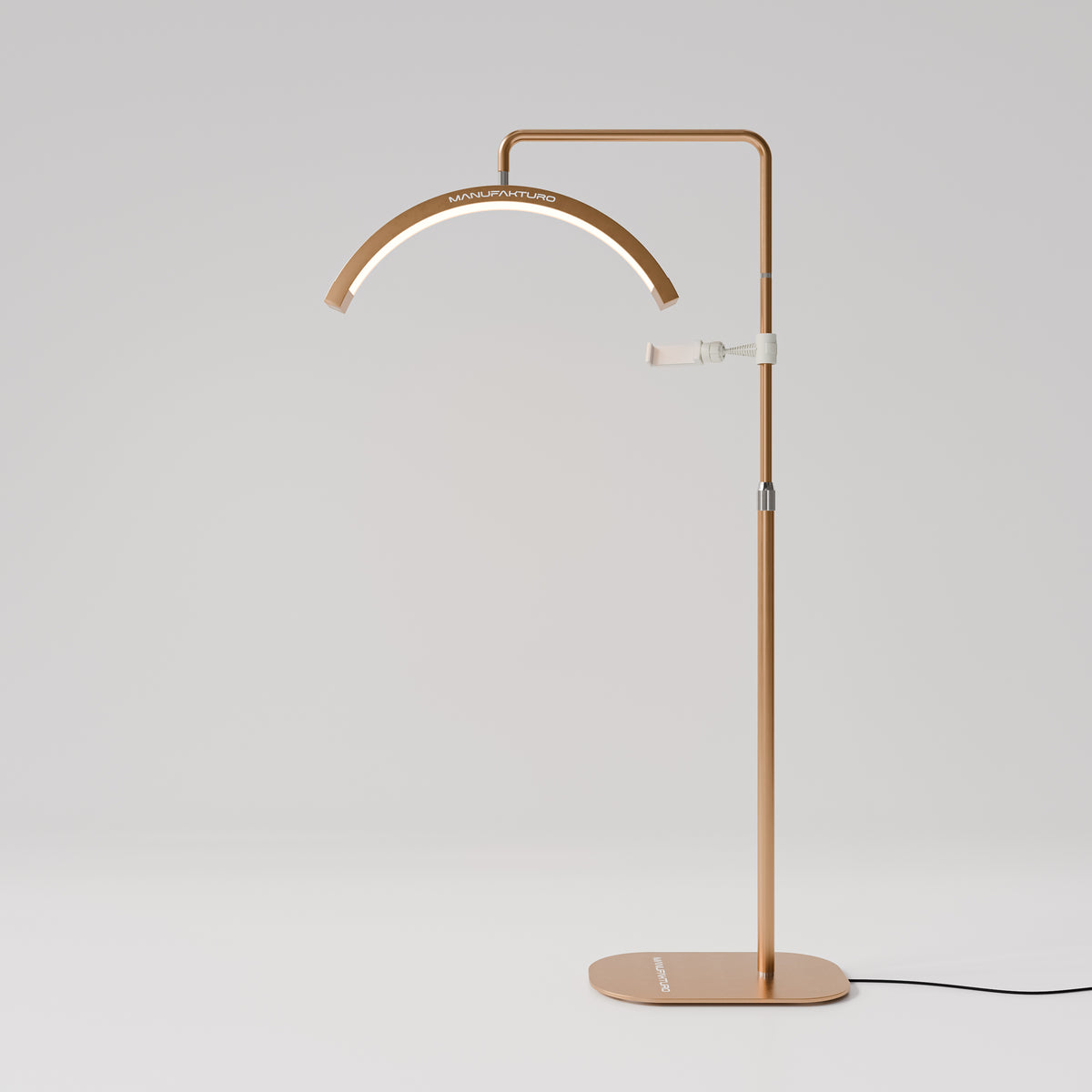 Manufakturo Beauty LED Rotating Head Treatment Lamp - Adjustable Colour Temp Brown Gold - LED treatment lamp with adjustable light arms on a white background