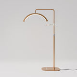 Manufakturo Beauty LED Rotating Head Treatment Lamp - Adjustable Colour Temp Brown Gold - LED treatment lamp with adjustable light arms on a white background