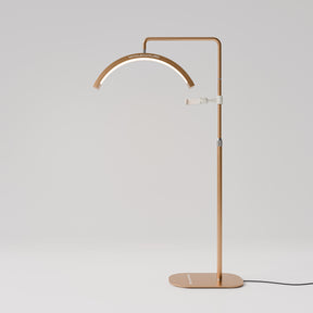 Manufakturo Beauty LED Rotating Head Treatment Lamp - Adjustable Colour Temp Brown Gold - LED treatment lamp with adjustable light arms on a white background