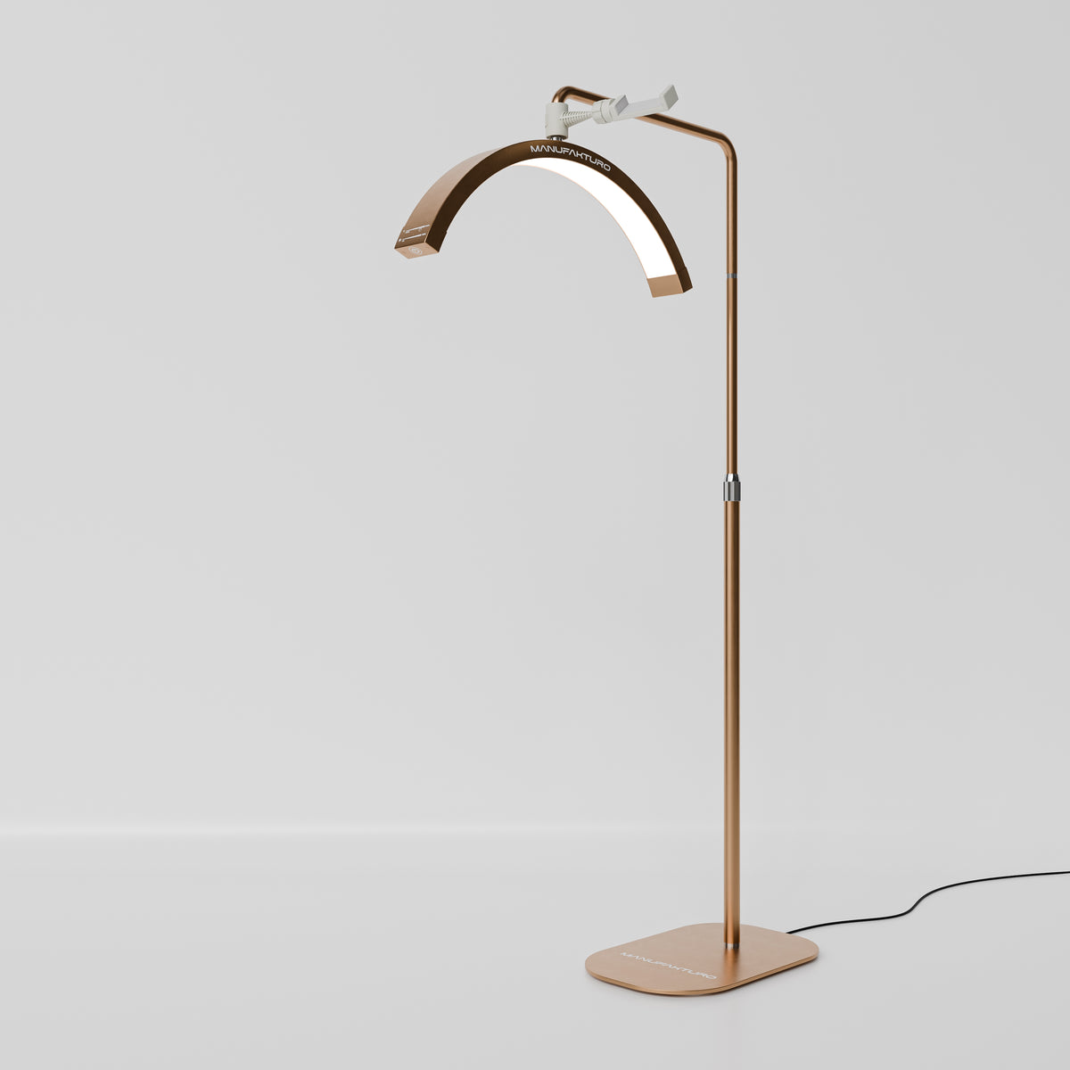 Manufakturo Beauty LED Rotating Head Treatment Lamp - Adjustable Colour Temp Brown Gold - LED treatment lamp with adjustable light arms on a white background