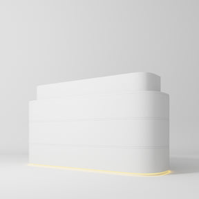 Manufakturo Lueur Premium Reception Desk for Luxury Beauty Salon with LED Base White - displayed in a professional treatment-room setting