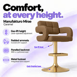 Manufakturo Mirae Caramel salon and reception bar stool with lever-operated gas-lift height adjustment, padded curved armrests, a panelled backrest, cushioned seat, integrated metal footrest and gold-finished pedestal base.