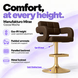 Manufakturo Mirae Cocoa Mocha salon and reception bar stool with lever-operated gas-lift height adjustment, padded curved armrests, a panelled backrest, cushioned seat, integrated metal footrest and gold-finished pedestal base.