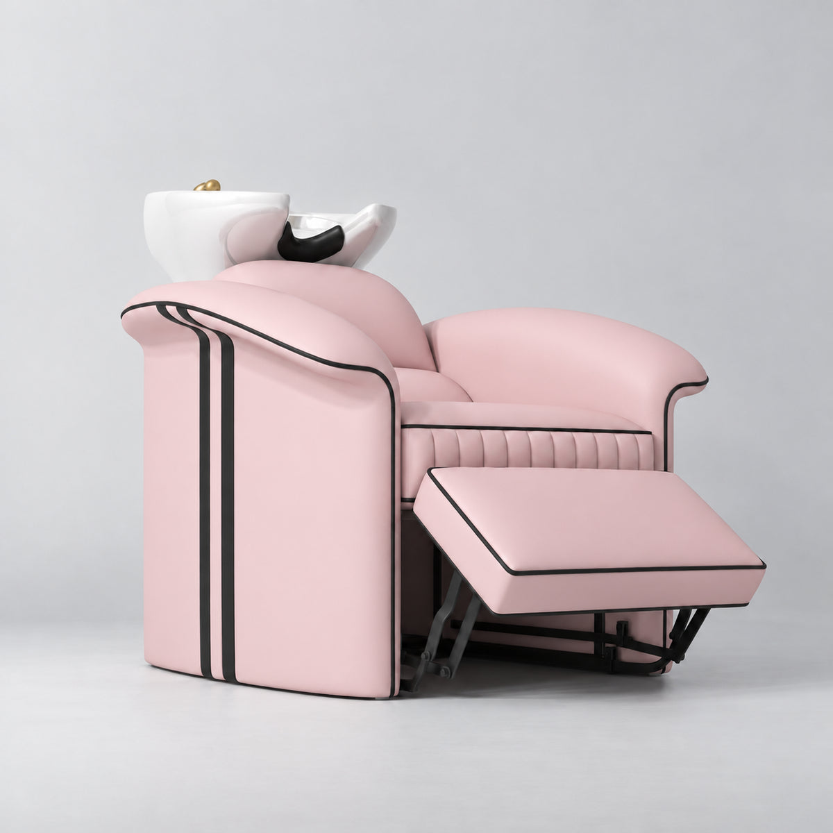 Manufakturo Monaco Bare Blush backwash unit with white basin and extended electric leg rest, viewed from the front at an angle.