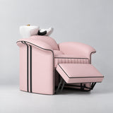 Manufakturo Monaco Bare Blush backwash unit with white basin and extended electric leg rest, viewed from the front at an angle.