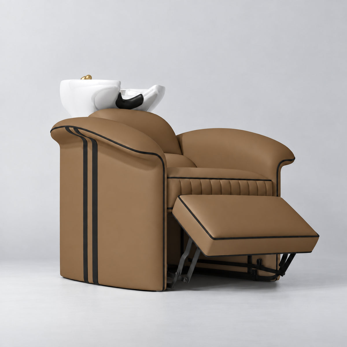 Manufakturo Monaco Caramel backwash unit with white basin and extended electric leg rest, viewed from the front at an angle.