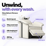 Manufakturo Monaco Creamy backwash unit with electric leg rest, tilting ceramic basin, USB charging port and 300 kg maximum load.