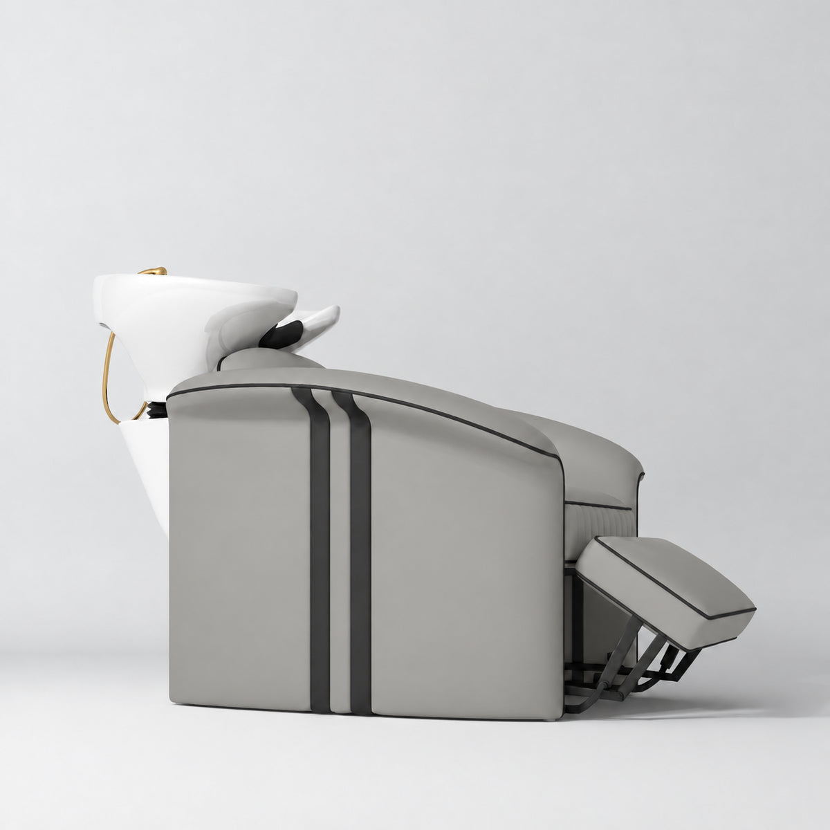 Manufakturo Monaco Pearl Greige backwash unit with white basin and extended electric leg rest, shown from a low side angle.