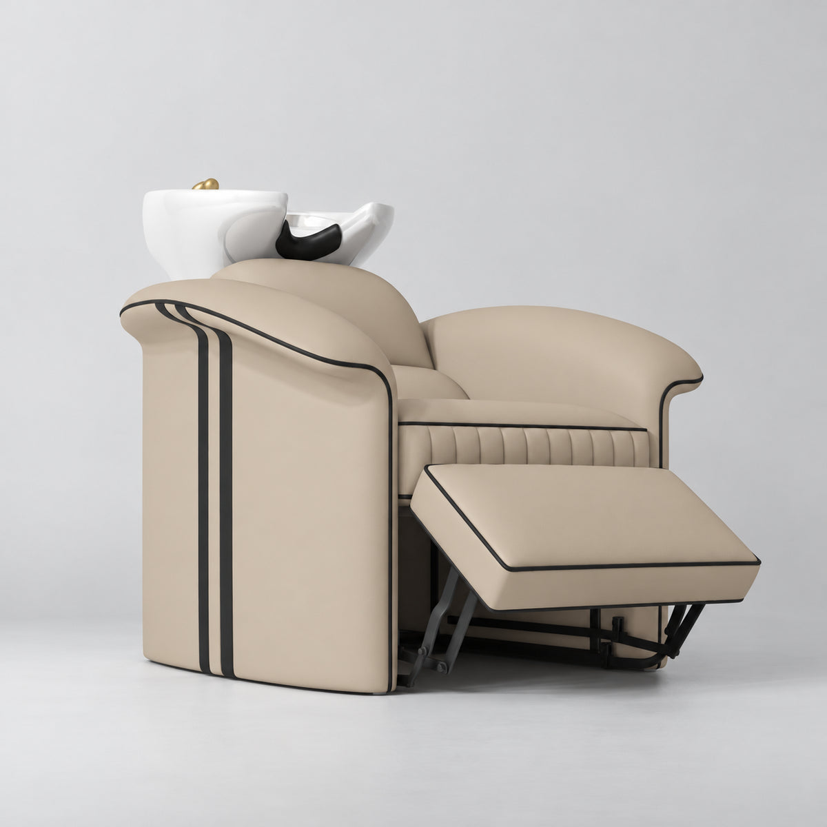Manufakturo Monaco Warm Beige backwash unit with white basin and extended electric leg rest, viewed from the front at an angle.