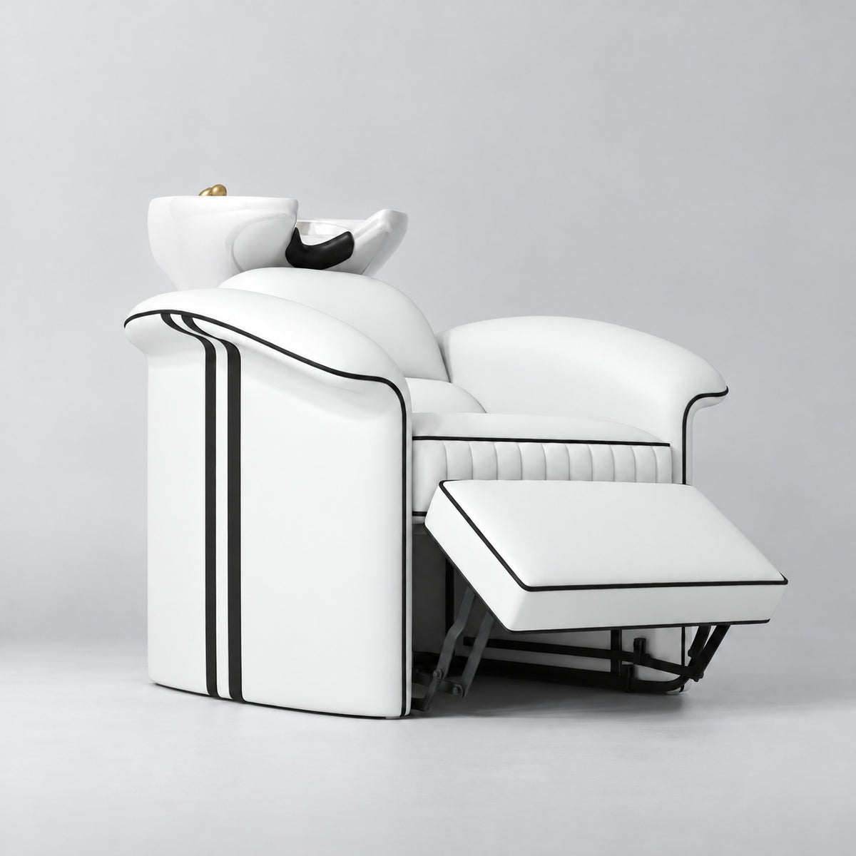 Manufakturo Monaco White backwash unit with white basin and extended electric leg rest, viewed from the front at an angle.