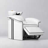 Manufakturo Monaco White backwash unit with white basin and extended electric leg rest, viewed from the front at an angle.