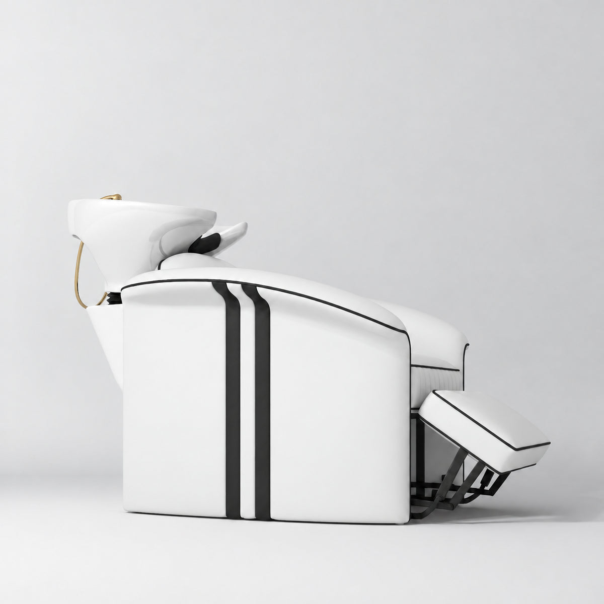 Manufakturo Monaco White backwash unit with white basin and extended electric leg rest, shown from a low side angle.