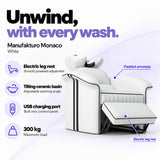 Manufakturo Monaco White backwash unit with electric leg rest, tilting ceramic basin, USB charging port and 300 kg maximum load.