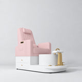 Manufakturo Noémie Bare Blush electric pedicure chair with massage backrest, gold tap, empty ceramic basin and smooth white foot support.