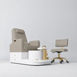 Manufakturo Noémie Stone Taupe two-piece pedicure set with electric massage chair, gold tap, smooth foot support and matching rolling stool.