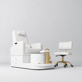 Manufakturo Noémie White two-piece pedicure set with electric massage chair, gold tap, smooth foot support and matching rolling stool.