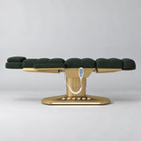 Manufakturo Orielle A Dark Green teddy electric beauty bed in a flat position viewed from the side, with gold oval base and hand-held controller.