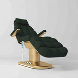 Manufakturo Orielle A Dark Green teddy electric beauty bed with gold oval base and current hand-held controller.