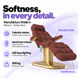 Manufakturo Orielle A Maroon teddy electric beauty bed features: 3 motors, hand and foot controls, LED base lighting, 300 kg maximum load, removable armrests and extendable footrest.