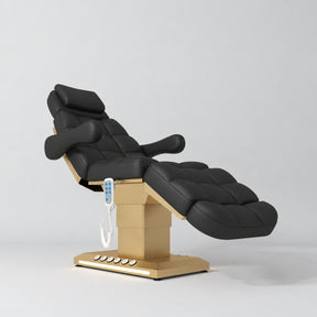 Manufakturo Orielle B Black electric beauty bed with gold base and current hand-held controller.