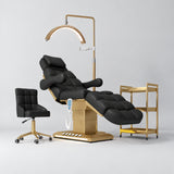 Manufakturo Orielle B Black four-piece beauty studio set with Noblesse chair, V3 Pro Gold treatment lamp, empty gold trolley and current hand control.