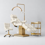 Manufakturo Orielle B Creamy four-piece beauty studio set with Noblesse chair, V3 Pro Gold treatment lamp, empty gold trolley and current hand control.