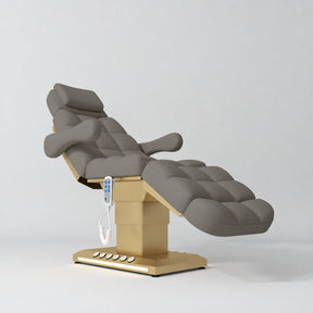Manufakturo Orielle B Deep Ash electric beauty bed with gold base and current hand-held controller.