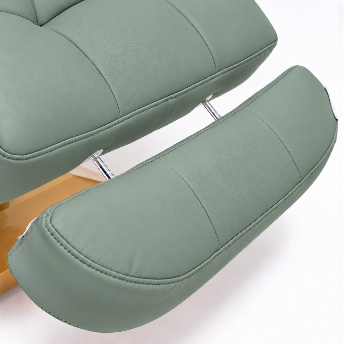 Manufakturo Orielle B Olive extendable footrest showing faux-leather upholstery, stitching and chrome extension rods.