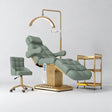 Manufakturo Orielle B Olive four-piece beauty studio set with Noblesse chair, V3 Pro Gold treatment lamp, empty gold trolley and current hand control.