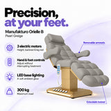 Manufakturo Orielle B Pearl Greige electric beauty bed features: 3 motors, hand and foot controls, LED base lighting, 300 kg maximum load, removable armrests and extendable footrest.