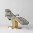 Manufakturo Orielle B Pearl Greige electric beauty bed with gold base and current hand-held controller.