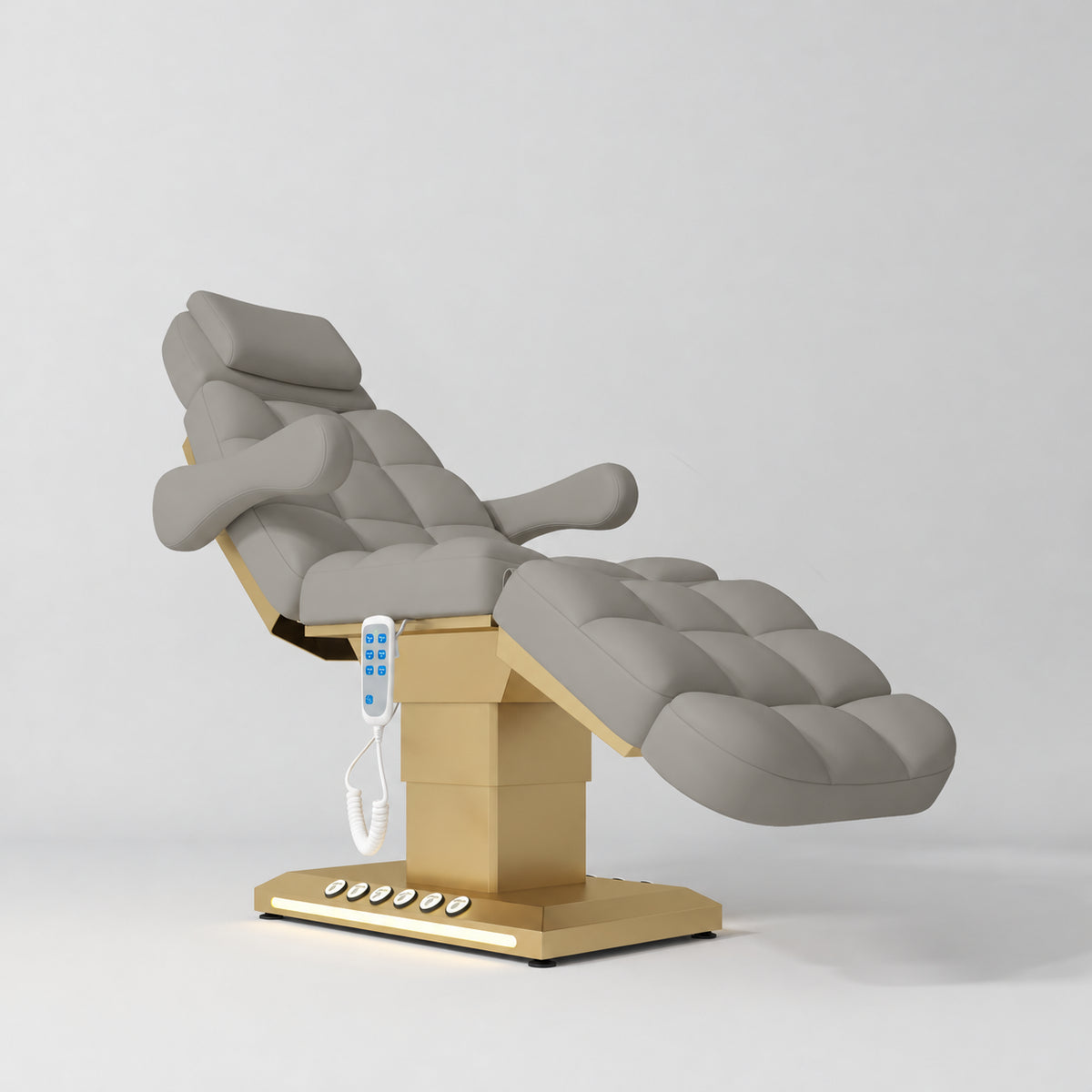 Manufakturo Orielle B Pearl Greige electric beauty bed with gold base and current hand-held controller.
