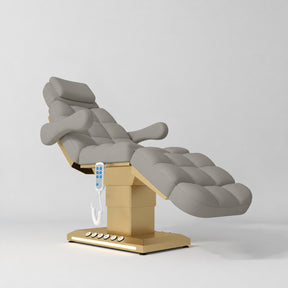 Manufakturo Orielle B Pearl Greige electric beauty bed with gold base and current hand-held controller.