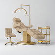 Manufakturo Orielle B Warm Beige four-piece beauty studio set with Noblesse chair, V3 Pro Gold treatment lamp, empty gold trolley and current hand control.