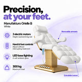 Manufakturo Orielle B White electric beauty bed features: 3 motors, hand and foot controls, LED base lighting, 300 kg maximum load, removable armrests and extendable footrest.
