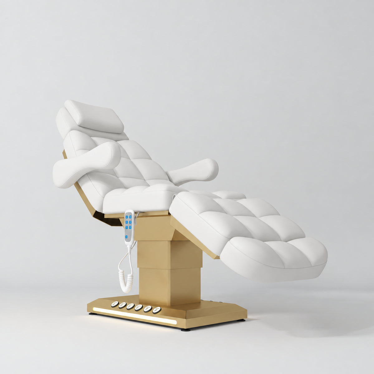 Manufakturo Orielle B White electric beauty bed with gold base and current hand-held controller.