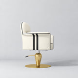 Side view of the Manufakturo Palais styling chair in Creamy with black piping and a gold pedestal base, on a grey studio background.
