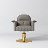 Front view of the Manufakturo Palais styling chair in Deep Ash with black piping and a gold pedestal base, on a grey studio background.