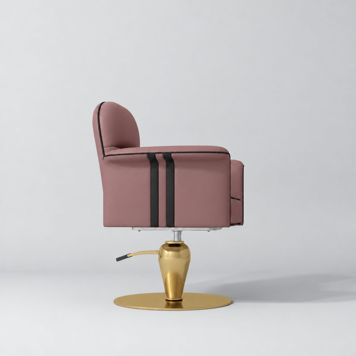 Side view of the Manufakturo Palais styling chair in Dusty Rose with black piping and a gold pedestal base, on a grey studio background.