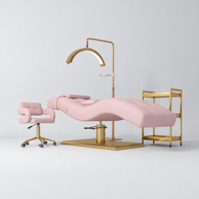 Manufakturo Prestige Bare Blush studio set with hydraulic lash bed, Serenity chair, V3 Pro Gold lamp and empty gold trolley.