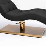 Manufakturo Prestige Black upholstered bed close-up with gold hydraulic pump, black foot pedal and rectangular gold base.