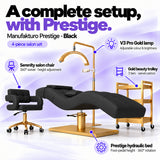 Manufakturo Prestige Black four-piece salon set features: hydraulic bed, Serenity chair, V3 Pro Gold lamp and gold trolley.