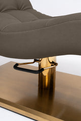 Manufakturo Prestige Cocoa Mocha close-up of upholstered stitching, gold hydraulic column and black foot pedal.