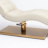 Manufakturo Prestige Creamy upholstered bed close-up with gold hydraulic pump, black foot pedal and rectangular gold base.