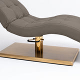 Manufakturo Prestige Deep Ash upholstered bed close-up with gold hydraulic pump, black foot pedal and rectangular gold base.