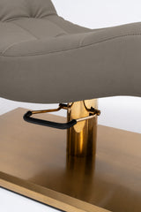 Manufakturo Prestige Deep Ash close-up of upholstered stitching, gold hydraulic column and black foot pedal.