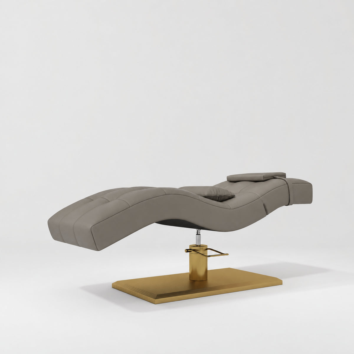 Manufakturo Prestige Deep Ash hydraulic eyelash bed, three-quarter side view with gold pedestal base and contoured upholstery.
