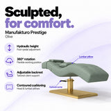 Manufakturo Prestige Olive hydraulic eyelash bed with foot-pedal height adjustment, 360-degree rotation, adjustable backrest and head and lumbar pillows.