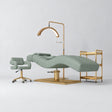 Manufakturo Prestige Olive studio set with hydraulic lash bed, Serenity chair, V3 Pro Gold lamp and empty gold trolley.