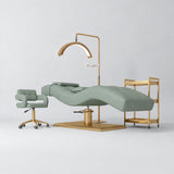 Manufakturo Prestige Olive studio set with hydraulic lash bed, Serenity chair, V3 Pro Gold lamp and empty gold trolley.